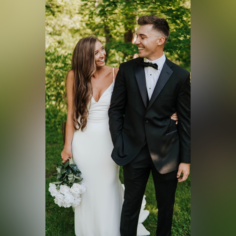Kelly Faetanini wedding dress with cowl back detail and faux button back.